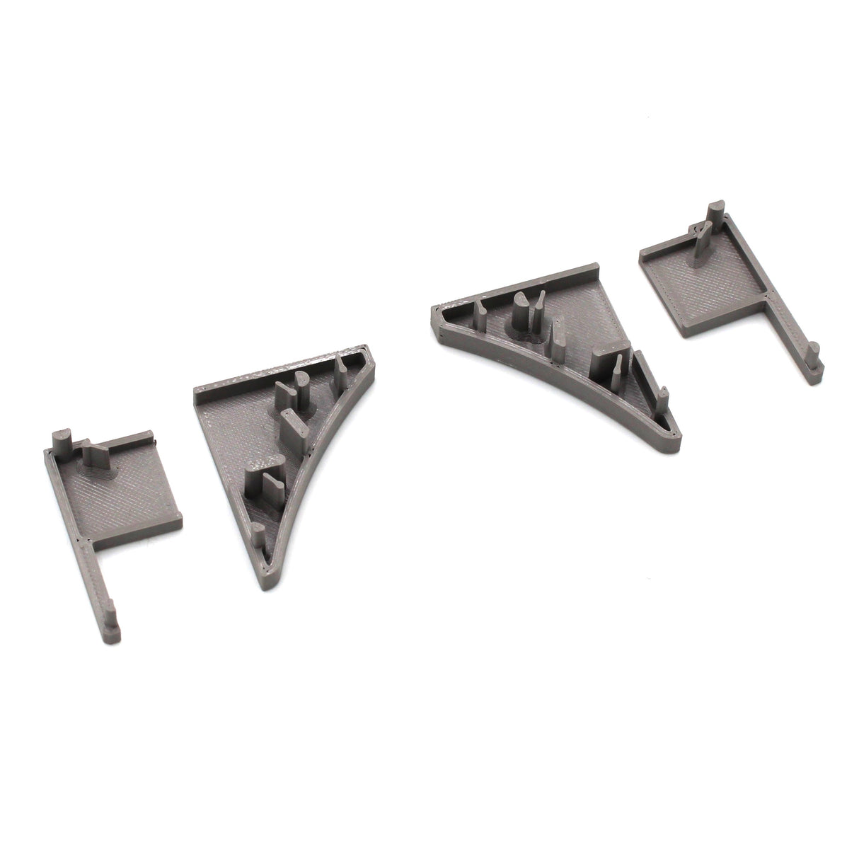 Two gray End Caps for Pula P10 Profile, 3D-printed in PETG and featuring rectangular shapes with triangular, curved supports and notches, are displayed against a white background.