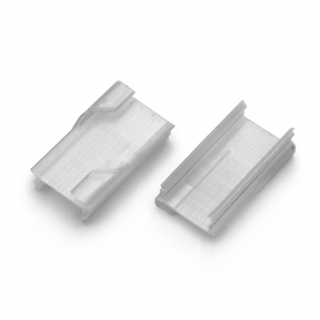 Two small, clear Roma XL Drop Ceiling Clips with angled edges and grooves sit side by side on a white background—perfect 3D printed push-fit clips for mounting the Roma XL profile to a drop ceiling.