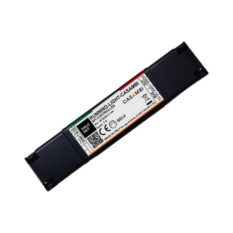 A rectangular black device labeled “RUNNING-LIGHT-CASAMBI” is a SPI Controller with Casambi for Pixel Digital LED Strip, featuring technical details, barcodes, and certification logos on a white sticker.