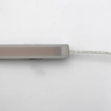 A close-up of the White Universal Surface-mount Waterproof Outdoor LED Lighting Fixture (24V) ~ Roma Series, featuring a slim, rectangular frosted bar with a clear cord on the right, displayed against a white background.