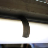 A Mounting Clip for 2.56" Round Profiles secures a fluorescent tube, shown with a crescent-shaped smudge on its surface, beneath a metal fixture.