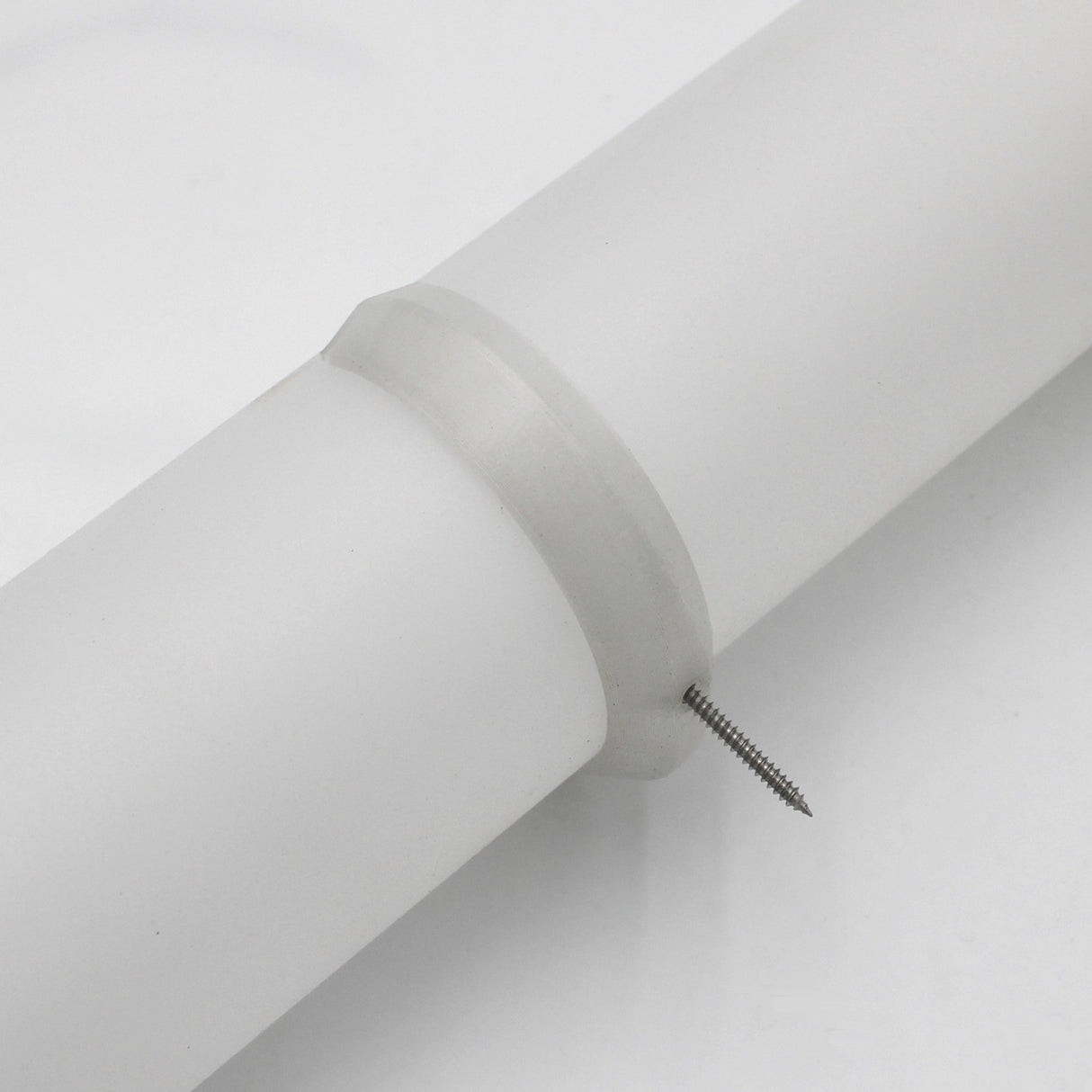 The Mounting Clip for 2.56" Round Profiles secures a cylindrical white pipe with a metal screw, all shown against a plain white background.