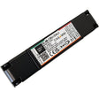 A rectangular black device labeled SLIM-CBU-DALI, featuring technical specs, certification logos, and barcodes on a white sticker. The Slimline Casambi to DALI Signal Converter (Model SLIM-CBU-DALI) enables professional lighting control integration.