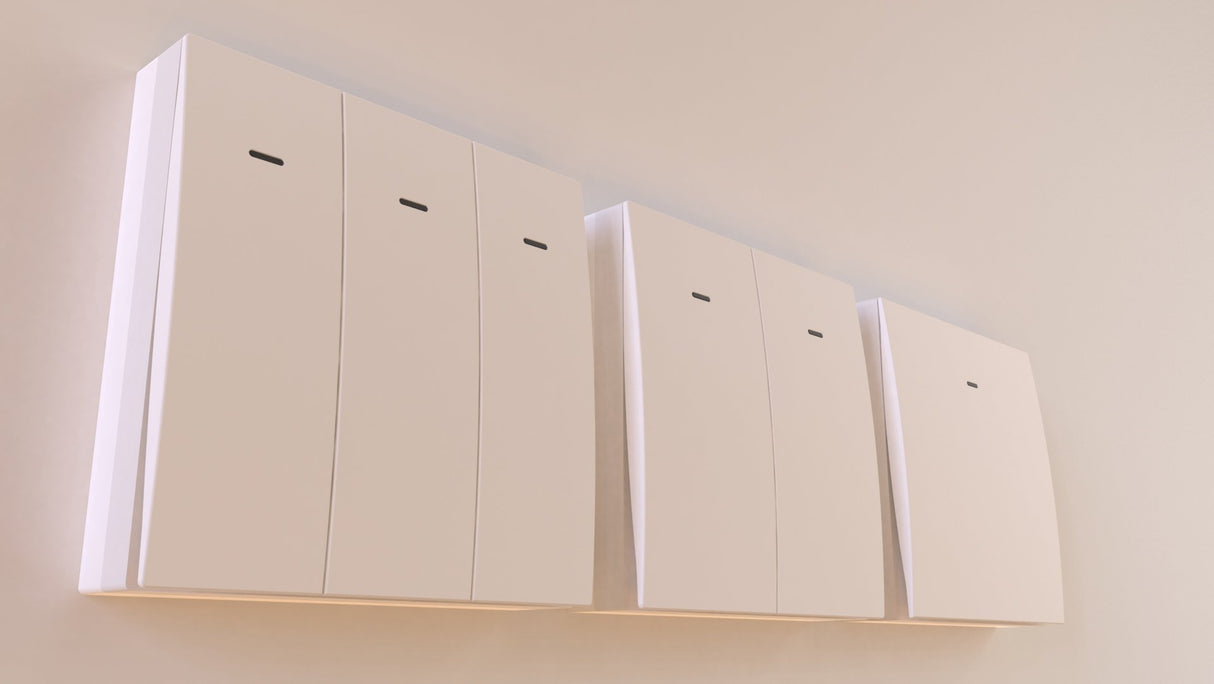 Four minimalist, wall-mounted white cabinets with subtle horizontal slots are arranged in a row against a light-colored wall, featuring the Casambi Wireless Battery-Operated Single-Button Wall Switch (Eulum SWC-CSB-1R-W) for convenient lighting control.