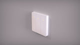 A Casambi Wireless Battery-Operated 3-Button Wall Switch (Eulum SWC-CSB-3R-W) is mounted on a light gray wall, each button with a yellow indicator for programmable functions and convenient wireless lighting control.