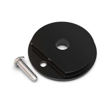 A black, round Plastic End Cap for Sierra38 Profile with two holes—one large, one small for a diffuser tube—shown next to a silver screw on a white background.