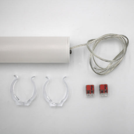 The Sierra38 Series 1.5" White Surface-mount LED Tube Lighting Fixture (24V) is shown on a white background with a clear cord, two clear mounting clips, two red and gray wire connectors, and mounting hardware.