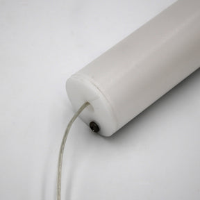 A close-up of the 1.5" White Surface-mount LED Tube Lighting Fixture (24V), Sierra38 Series, shows its cylindrical plug-and-play design with a transparent wire at one end, set against a plain white background.