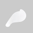 A translucent, wing-shaped patch with smooth edges is shown on a solid light gray background, illustrating the seamless finish typically achieved using the Spackle Mounting Tool for Smooth12 Profile.
