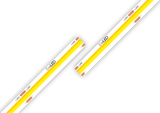 Two white High Brightness IP20 COB LED strips (24V) from the UniPlus Series, featuring yellow, dot-free illumination and labeled "EvoLED," are displayed against a white background. The strips are arranged diagonally and nearly touching at an angle, with copper connection points visible—making them ideal for seamless under-cabinet lighting solutions.