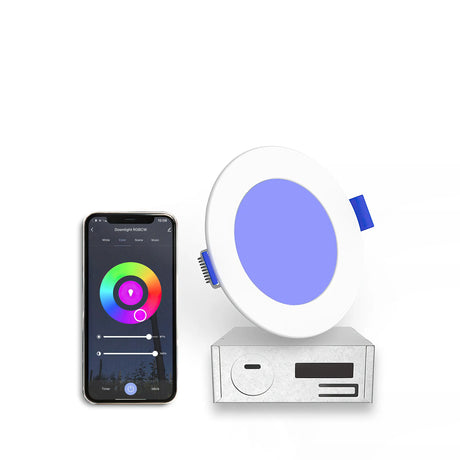 A smartphone shows a color wheel app next to the 4 Ultra-Slim RGB+CCT Smart Wireless Downlight (EnoLED WSD-RGBCW-4) glowing blue, connected to a white control box.