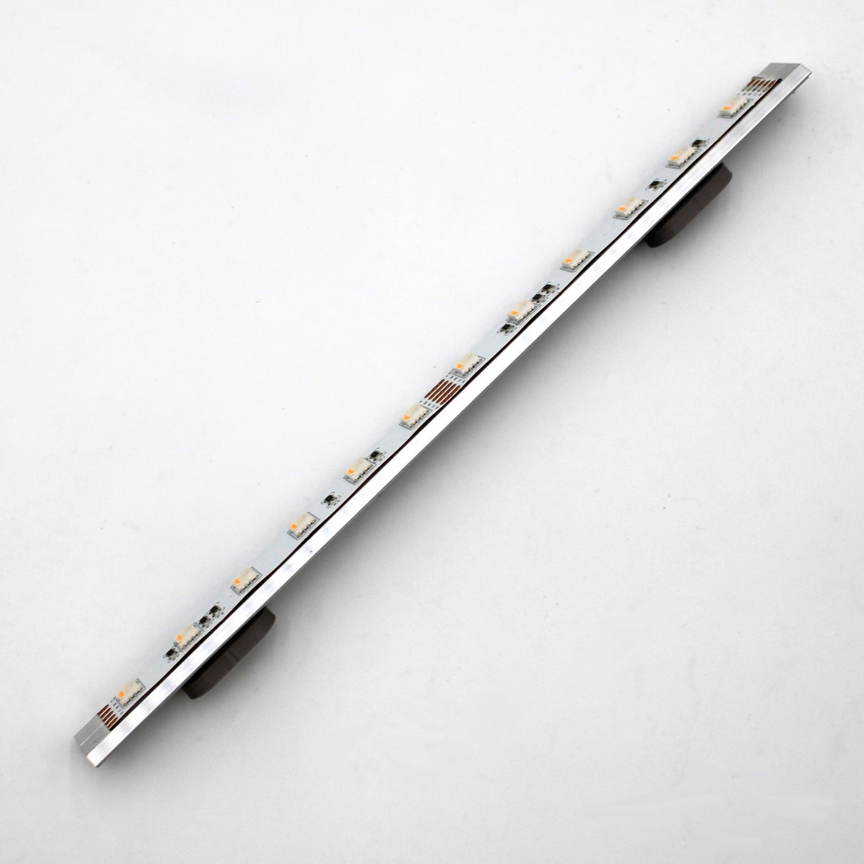 A slim, rectangular Yukon LED profile is displayed diagonally on a white background, featuring two Surface Mount for Yukon Profile accessories, locally 3D printed and attached underneath for surface installation.