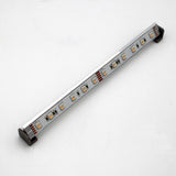 The Surface Mount for Yukon Profile is a slim LED profile with a silver finish and black end caps, evenly spaced LED bulbs, and compatibility with locally 3D printed surface mounting accessories, shown on a plain white background.