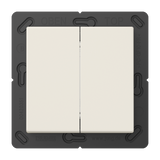 The Casambi 4-Channel Wireless Radio Transmitter (Model Jung BLE A 595) is a white double light switch with a black frame, labeled OBEN and TOP at the top and JUNG at the bottom. It supports energy harvesting tech. The background is gray.