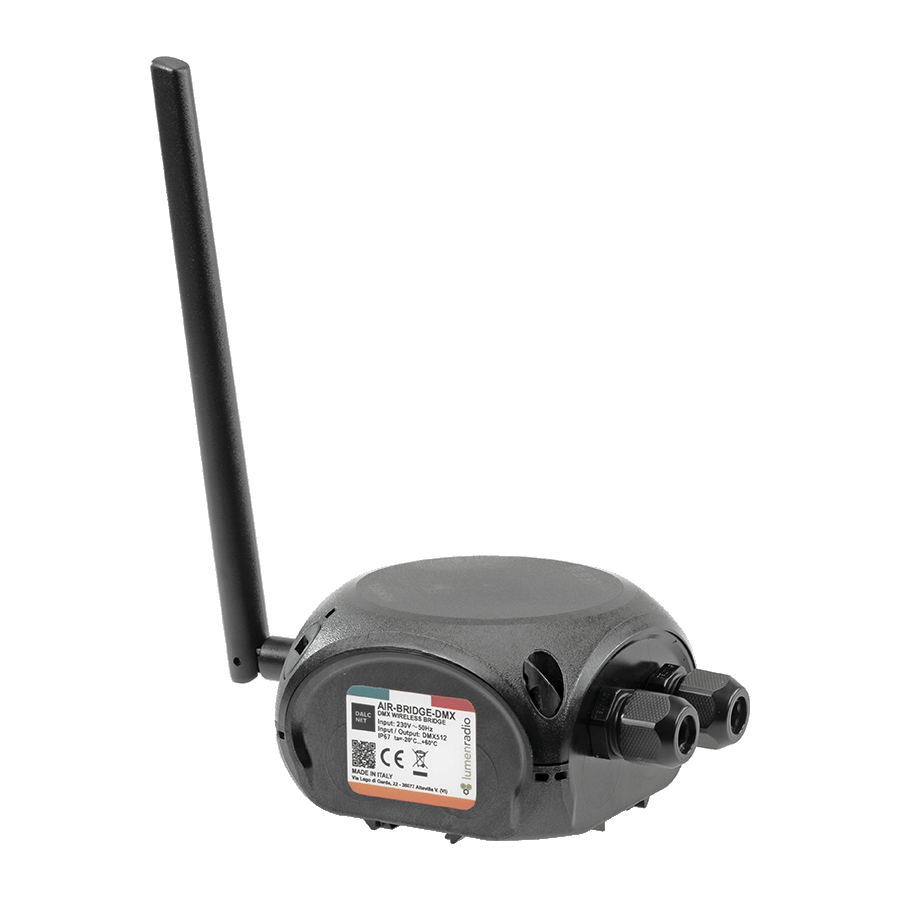 The AIR-BRIDGE-DMX is a black wireless DMX transmitter and receiver system featuring an antenna, two cable ports, and a side label with technical details, designed for reliable lighting control.