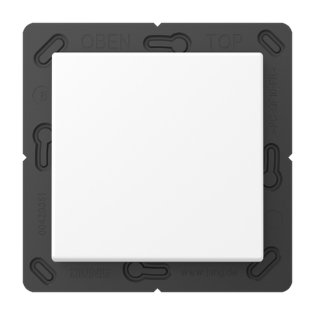 A Casambi 2-Channel Wireless Radio Transmitter (Jung BLE A 590) features a white square light switch with wireless control, mounted on a black square base, viewed from above, marked OBEN and TOP at the top edge.