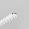 A white decorative molding or cornice, such as the Surface Mount LED Strip Channel ~ Model Surface10, is attached near the corner where the wall meets the ceiling, against a plain light gray background.
