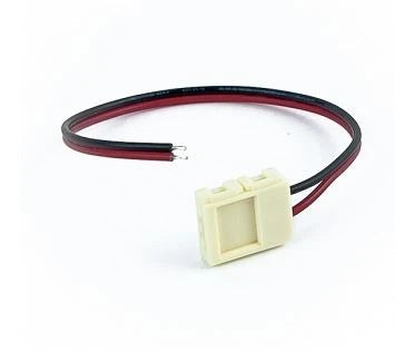 A 2-Pin Solderless White LED Strip Clip Connector (10mm) from the Neonica Series, featuring a compact plastic build with attached red and black wires ending in exposed tips—ideal for effortlessly connecting 10mm LED strips.