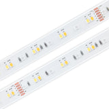 Close-up of two parallel RGB+CCT IP68 LED Strips (24V) from the Strelitzia Series on a white background, showing yellow and white LED components, resistors, and circuit traces. The image highlights the advanced design features typical of this color-changing LED strip.