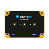 The Sauna WiFi Heating Controller ~ saunaBox by Blebox is a black rectangular smart unit with orange edges, three illuminated touch buttons, silver screws at each corner, and "made in Europe" plus Blebox logos on the front.