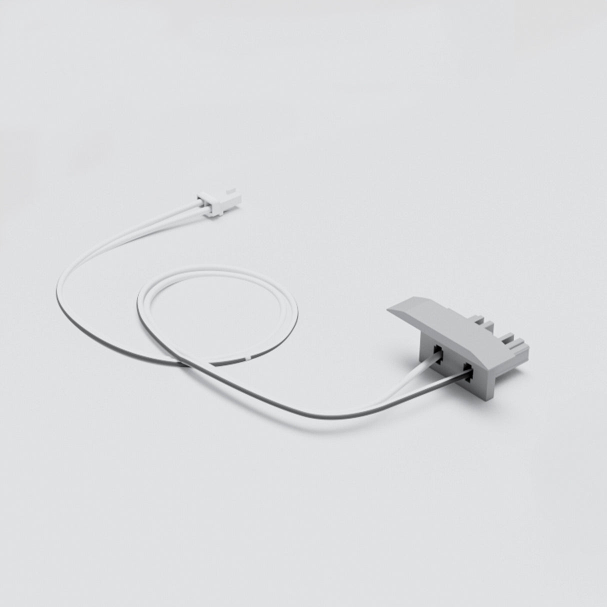 A white cable links the small Cut & Connect End Cap for Berlin Profile to a larger gray, three-pronged component, all on a plain light gray background—ideal for easy linear lighting installations.