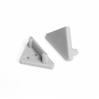 Two small gray plastic End Caps for Cabi12 Profile are shown—one flat displaying pegs and indents, the other upright with a smooth surface. Both have a minimalist design set against a white background.