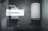 A wall-mounted boiler and cylindrical water heater are in a gray tiled room. A notification says: tempSensor DIN by Blebox—DHW temperature dropped below 25°C, detected by the DIN-rail Smart Wireless Temperature Sensor for monitoring.