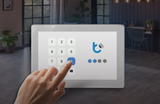 A hand presses the number nine on a 5″ Wi-Fi Touchscreen Smart Home Control Panel ~ controlPanelM by Blebox, which displays a numerical keypad.