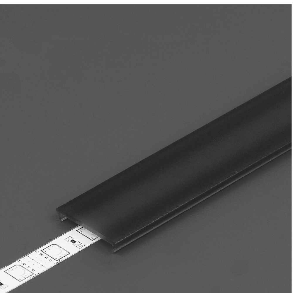 The LED Channel Cover ~ C6 Click, a black rectangular clip-in LED channel, partially covers a white LED strip with visible diodes, set against a plain dark gray background.