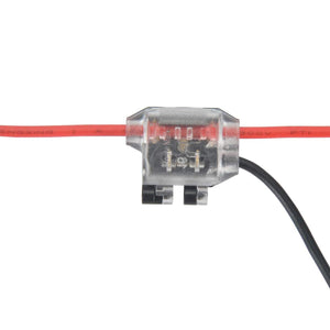 The 1-Pin Y-Tap Solderless Wire Splice Connector ~ Pelican Series features a transparent housing that showcases internal metal contacts, providing secure and easy low voltage connections for red and black insulated wires.