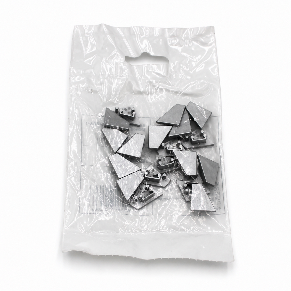 A clear plastic bag containing several small, triangular end caps for lighting fixtures—End Cap for Corner10.v2 Profile—displayed on a white background.