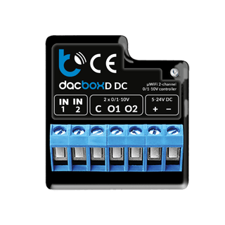A black and blue Smart WiFi 2-Channel 0-10V Controller (Model dacBoxD DC) features labeled input, output, and power terminals, visible connection ports, and company branding on the top surface.