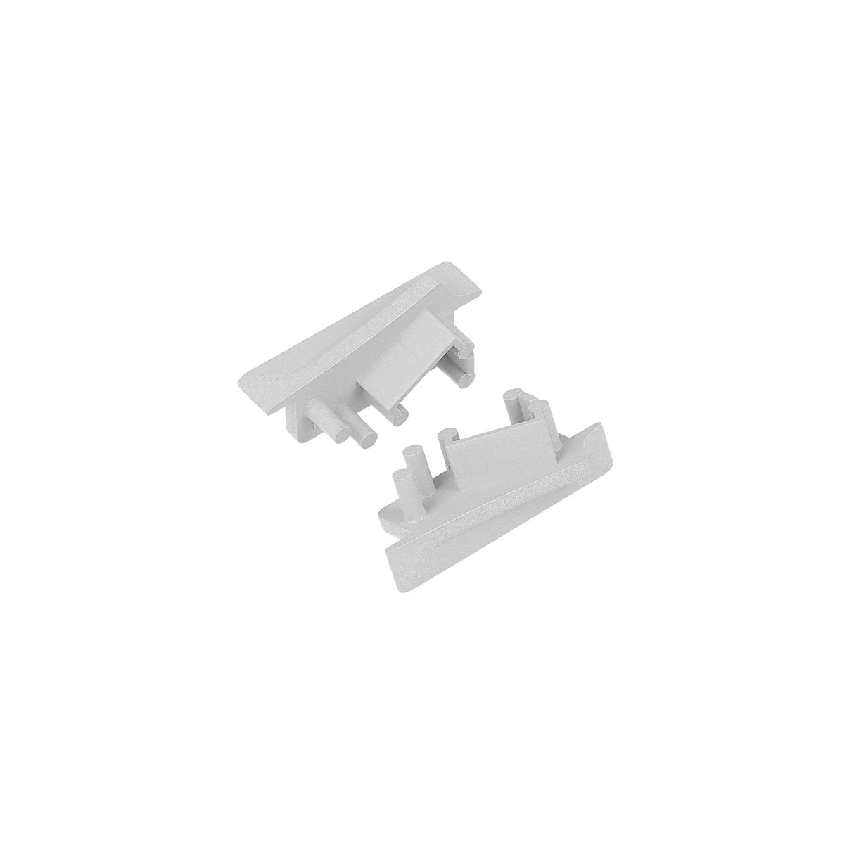 Two small, white ABS End Caps for Diagonal10 Profile with notched and grooved edges are shown on a plain white background. Perfect as corner pieces for lighting fixture installations.