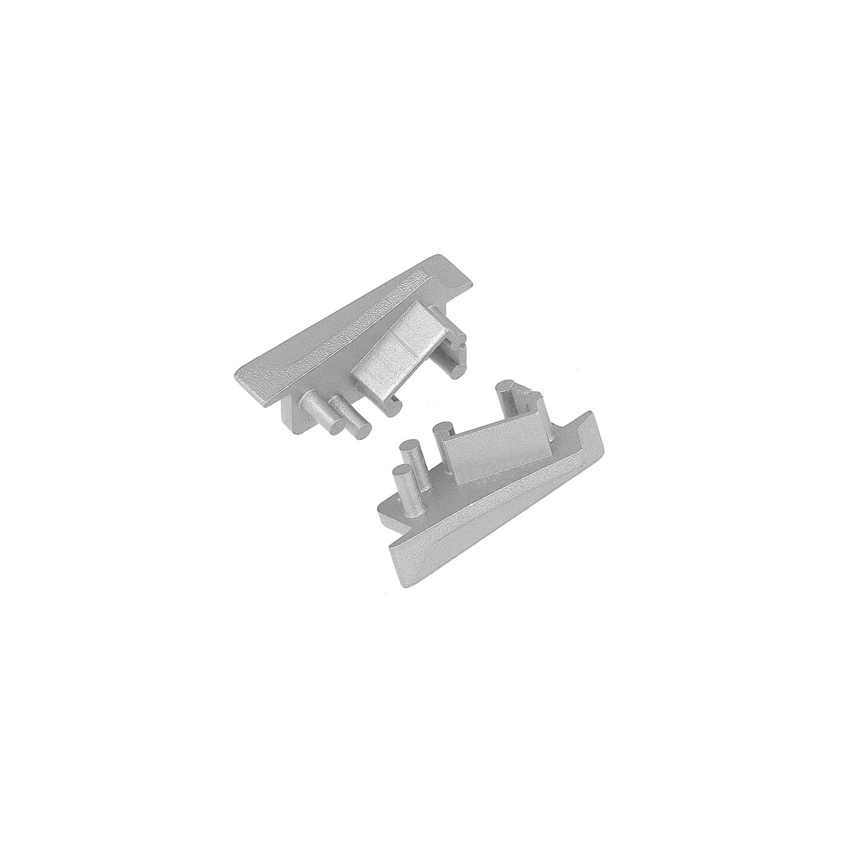 Two small, silver End Caps for Diagonal10 Profile made of ABS or metal with pegs and slots, placed on a white background in different orientations—perfect for finishing a lighting fixture.