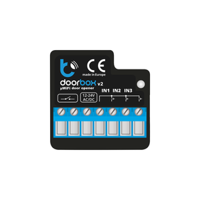 A black and blue Smart WiFi Remote Door and Gate Controller ~ doorBox by Blebox with terminals for IN1, IN2, IN3, 12-24V AC/DC input, indicator lights, and CE marking is shown on a white background.