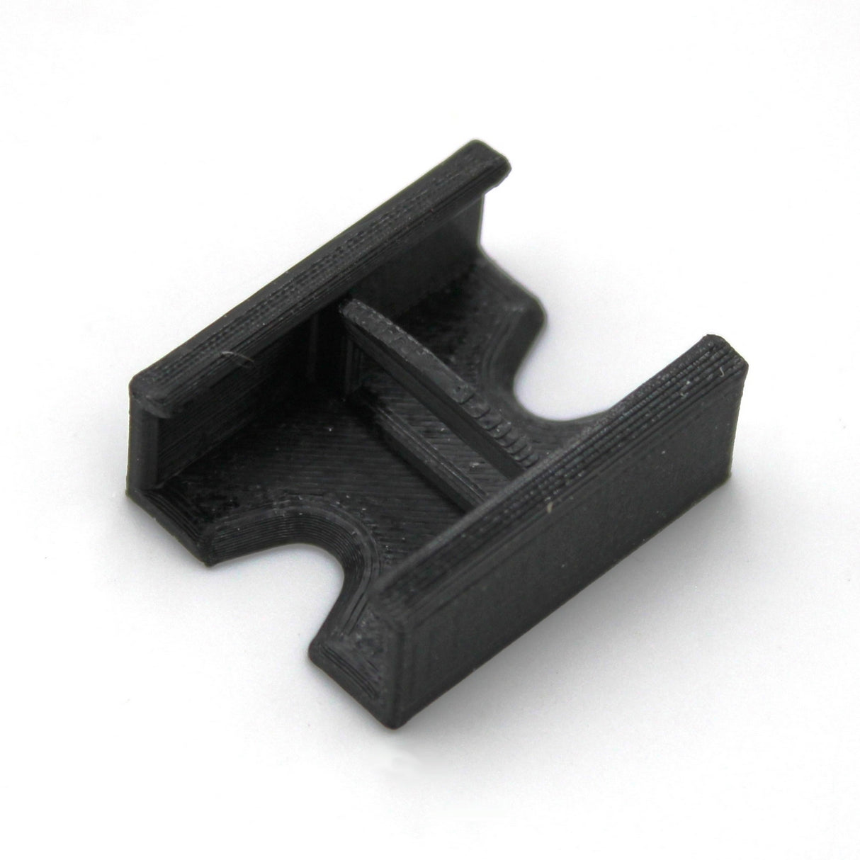 A compact, black, 3D-printed Linear Connector for SL7 Profile featuring parallel side walls and a central groove, shown on a white background.