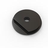 A black, round disc with a central hole and a wedge-shaped section removed, shown from an angled top view against a white background, designed to fit seamlessly with the Plastic End Cap for Sierra38 Profile.
