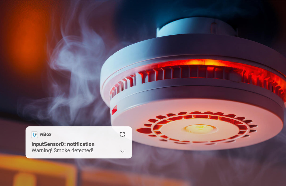 The 2-Channel Smart Wi-Fi Input Status Module ~ inputSensorD by Blebox detects smoke, glows red, and sends a screen alert: “inputSensorD: notification. Warning! Smoke detected!”—perfect for smart home automation systems.