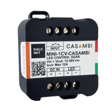 The MINI-1CV-CASAMBI is a black, rectangular Miniature 1-Channel LED Dimmer with Casambi, featuring screw terminals, labeled input/output, DALCNET and CASAMBI branding, and Casambi App compatibility for simple LED lighting control.