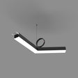 The PL55FL Modular LED Light Fixture System, a V-shaped black and white unit, hangs from the ceiling by a thin wire with cables at one end and a coiled black wire on top, set against a plain gray background.