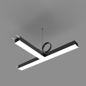 The PL55FL Modular LED Light Fixture System, featuring a modern black and white X-shaped design, hangs from the ceiling with exposed wiring against a plain gray background.