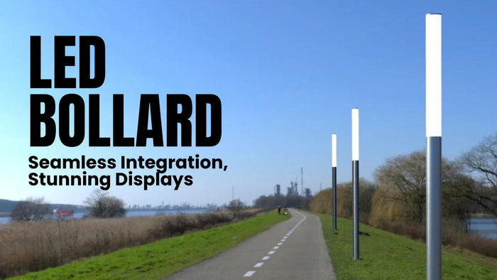 Modern LED bollard luminaire illuminating an outdoor pathway