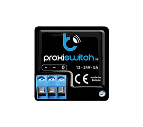 A black electronic device labeled proxiSwitch by BleBox, featuring blue and white text, terminal connectors, voltage ratings of 12-24V 5A, CE mark, and made in Europe—ideal as a touchless smart home proximity switch with invisible control buttons.