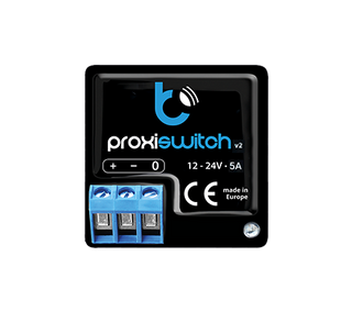 A black electronic device labeled proxiSwitch by BleBox, featuring blue and white text, terminal connectors, voltage ratings of 12-24V 5A, CE mark, and made in Europe—ideal as a touchless smart home proximity switch with invisible control buttons.