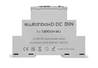 A white DIN-rail 2-Channel WiFi Relay labeled "switchBoxD DC DIN by Blebox," featuring technical specs, certification logos, and "made in Europe" text on its front, designed for DIN rail controller systems.