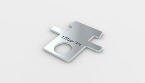 A small, flat, metallic Removing insert profile key for RPL55 led profile with a rectangular shape, circular hole near one end, and LEDS-ON engraved on the surface, made in Europe, shown on a plain white background.
