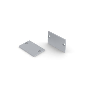 Two small, flat aluminum End Caps for RPL30 US Profile with rounded corners and two holes near opposite edges are shown—one flat, one upright—on a white background. Perfect for finishing your lighting fixture.